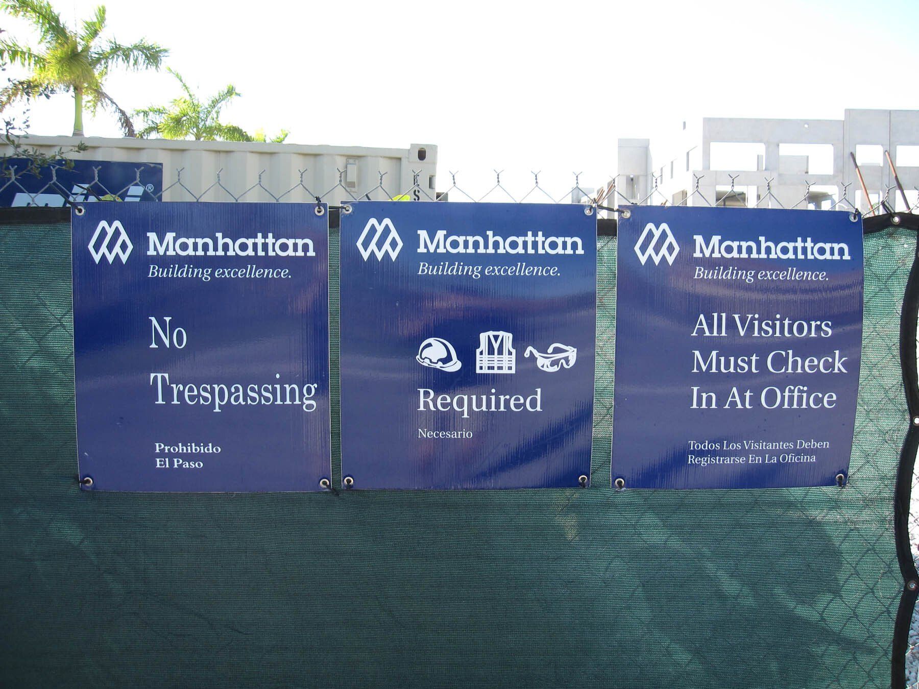 A manhattan sign that says no trespassing and all visitors must check in at office
