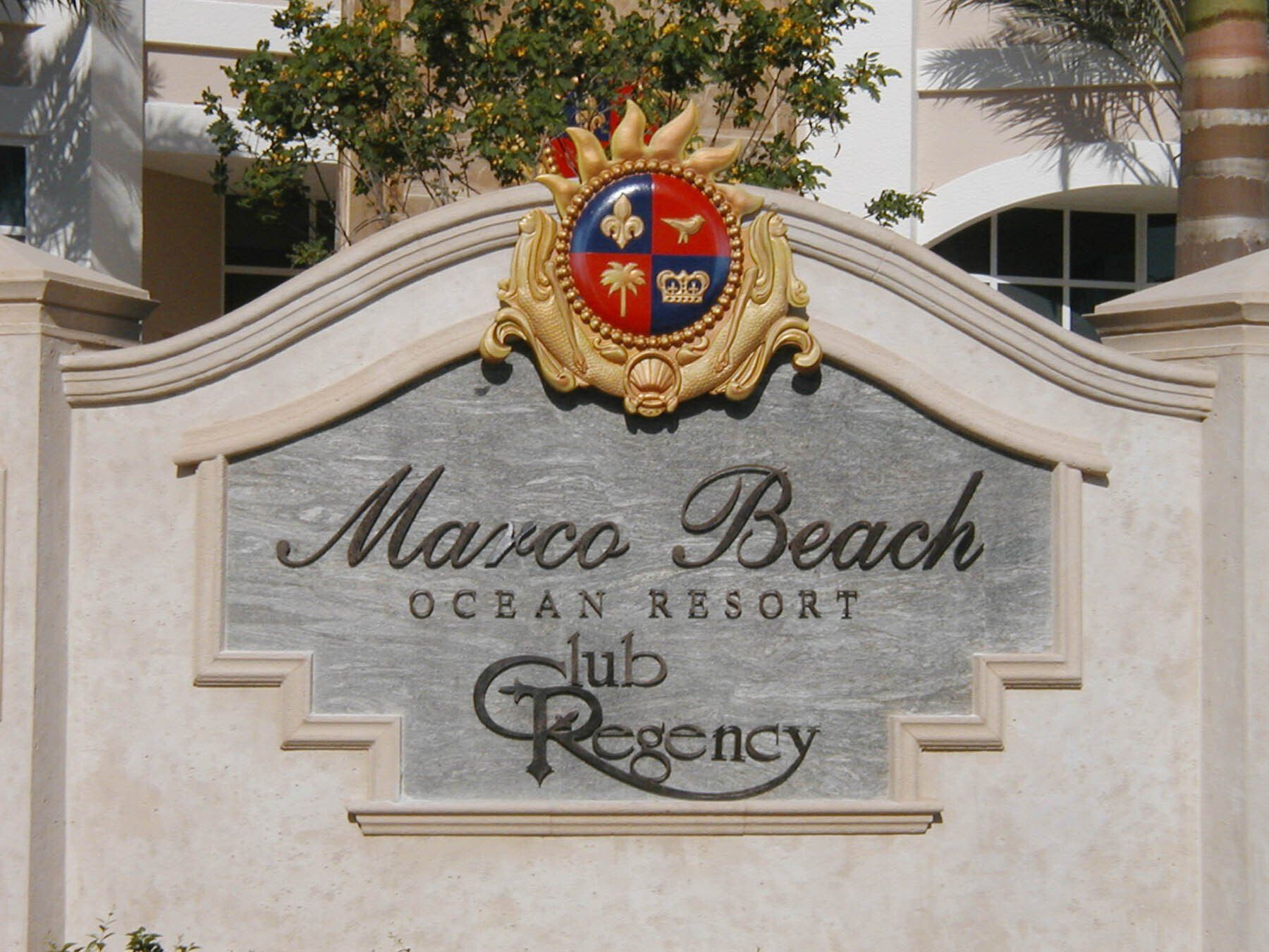 A sign for marco beach ocean resort club regency
