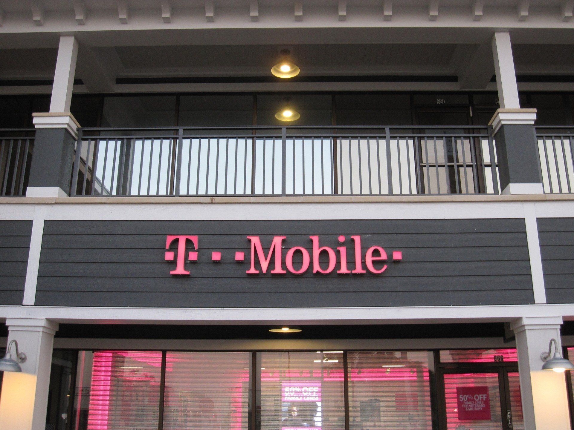 The front of a t-mobile store with a balcony
