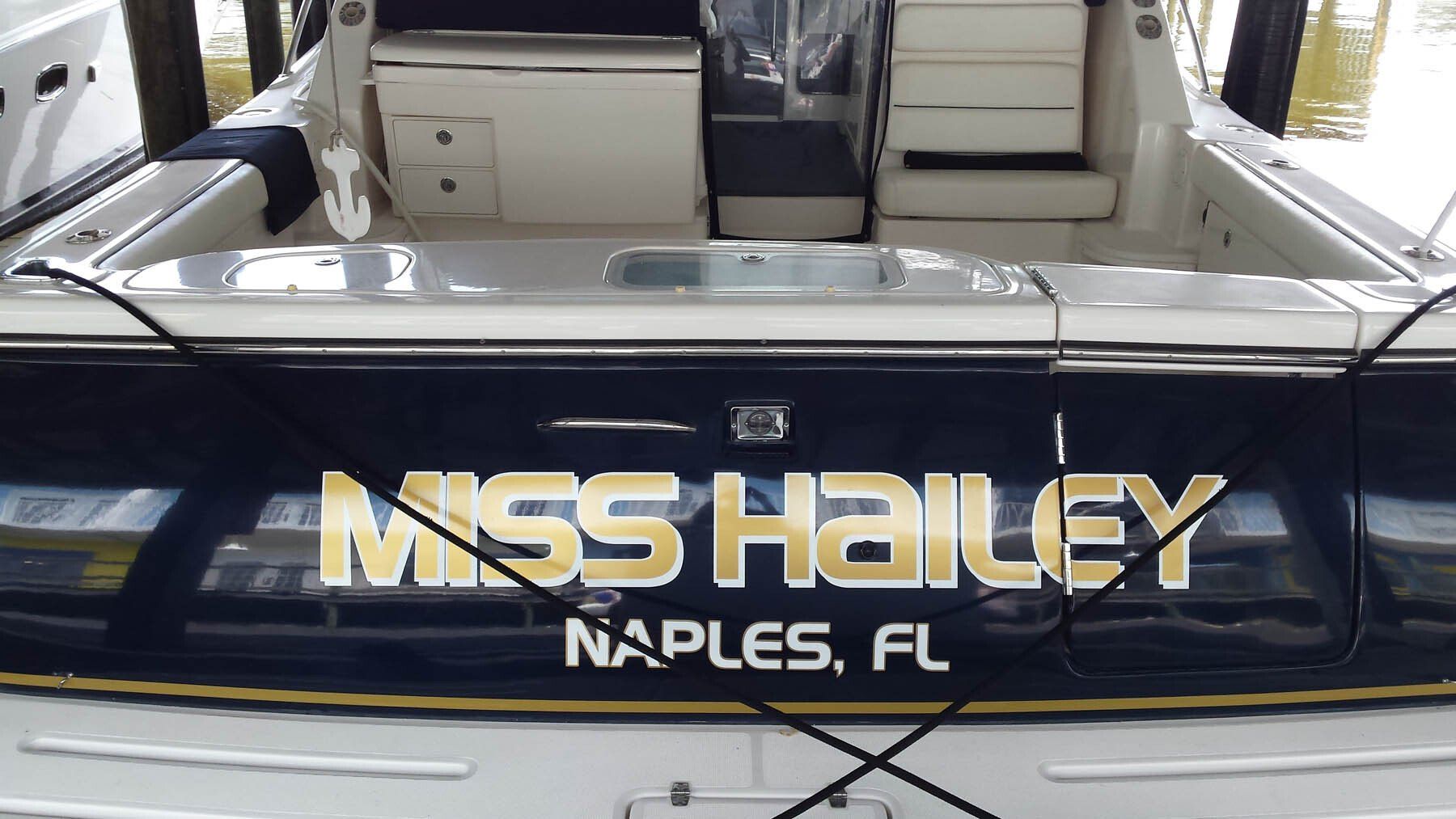 A boat with the name miss hailey on the back
