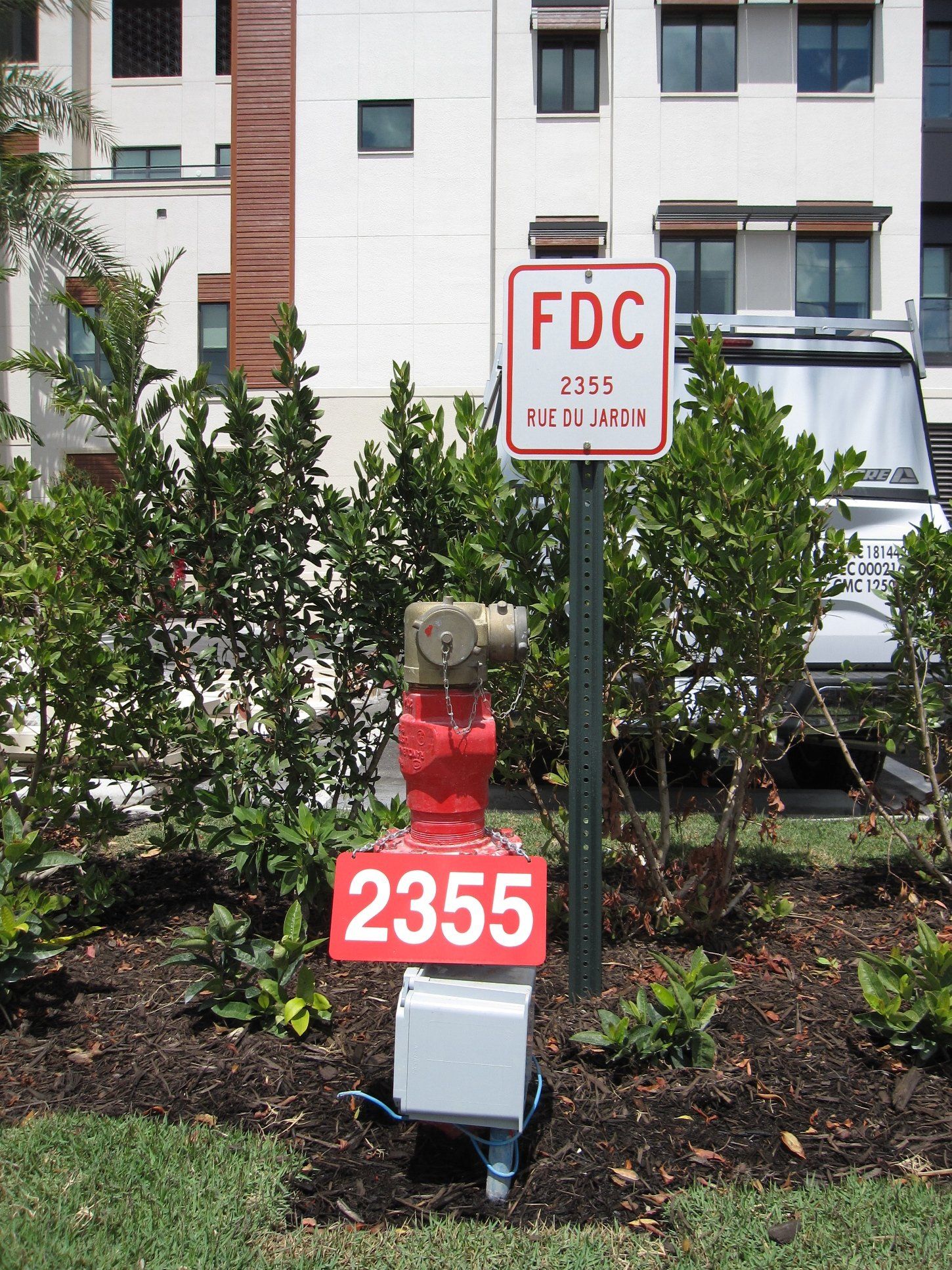 A red fire hydrant with the number 2355 on it