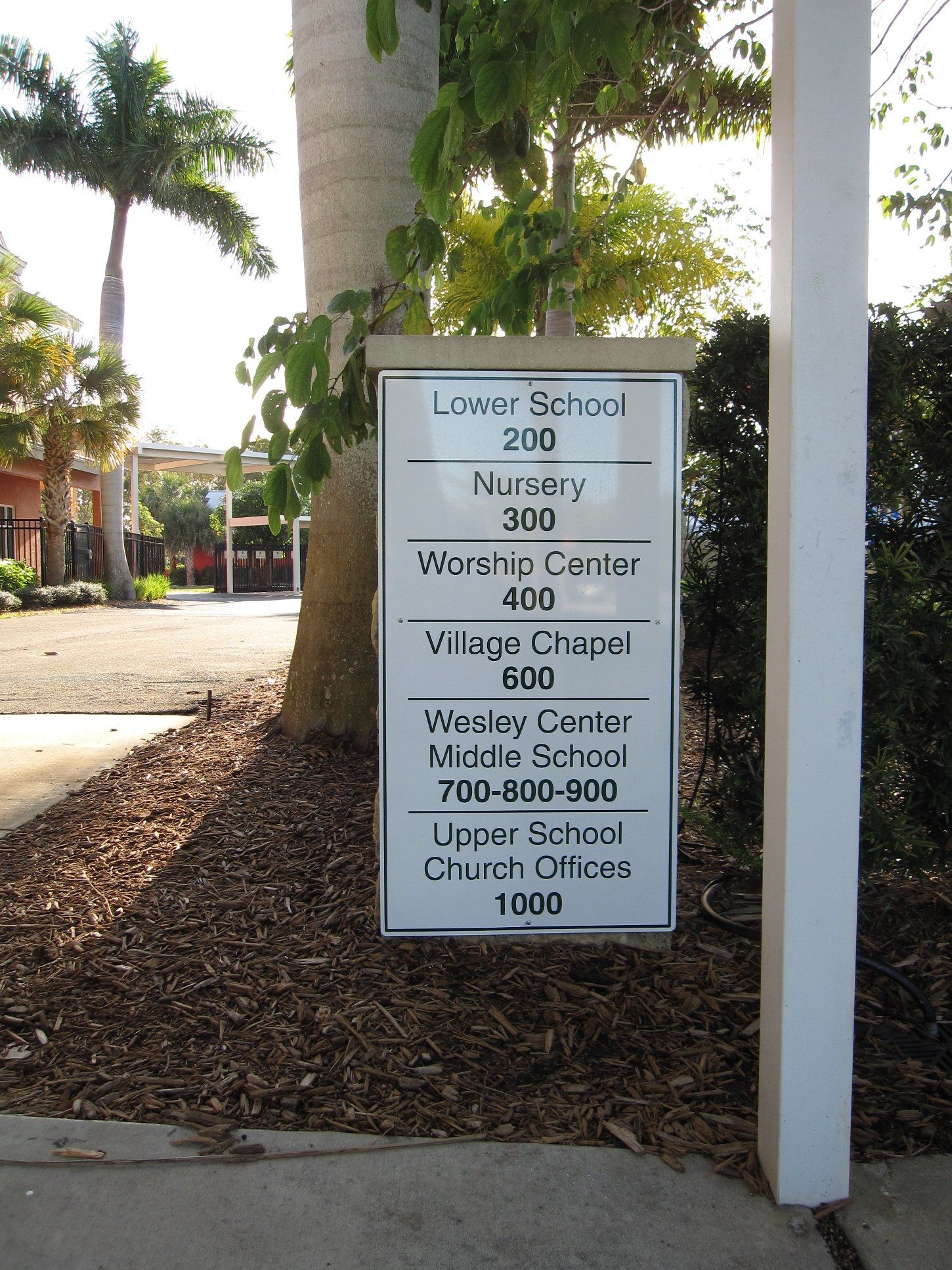 A sign that says lower school 200 nursery 300 worship center 400 village chapel 600