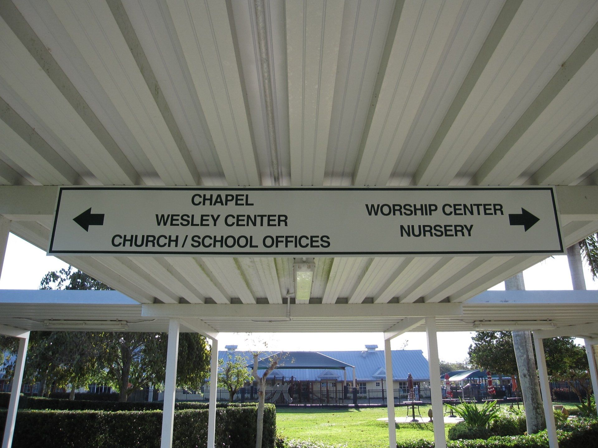 A sign that says chapel wesley center church / school offices