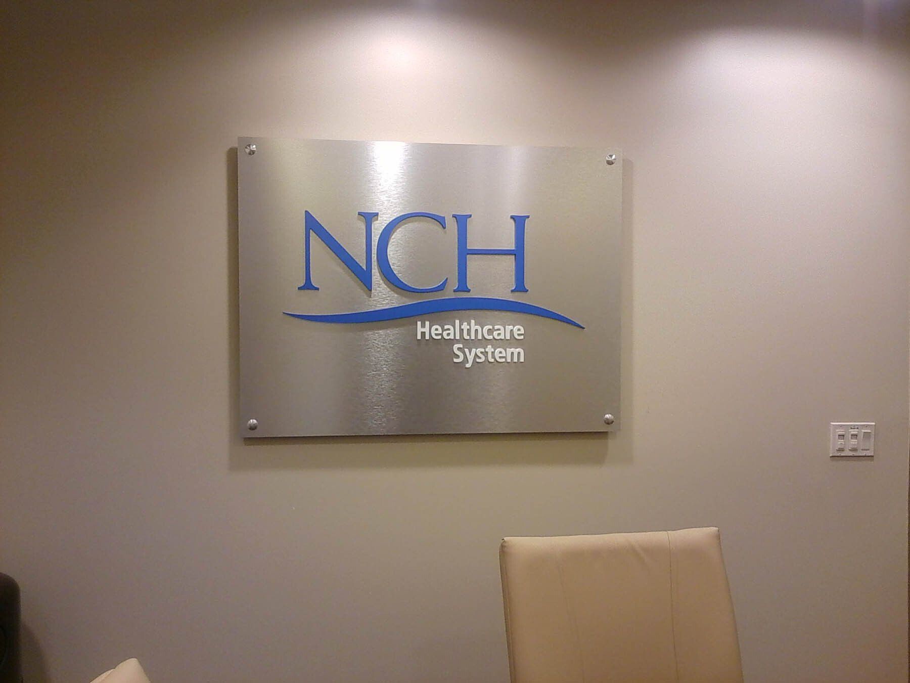A sign on a wall that says nch healthcare system