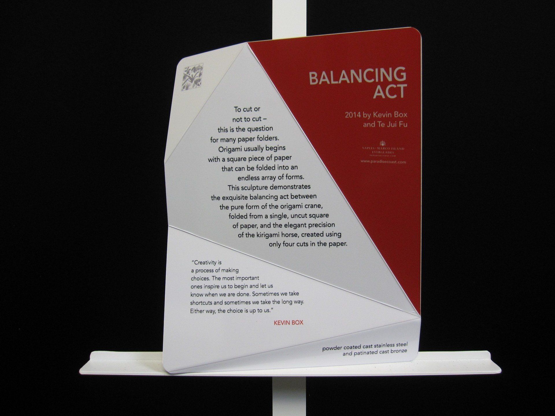A red and white book titled balancing act