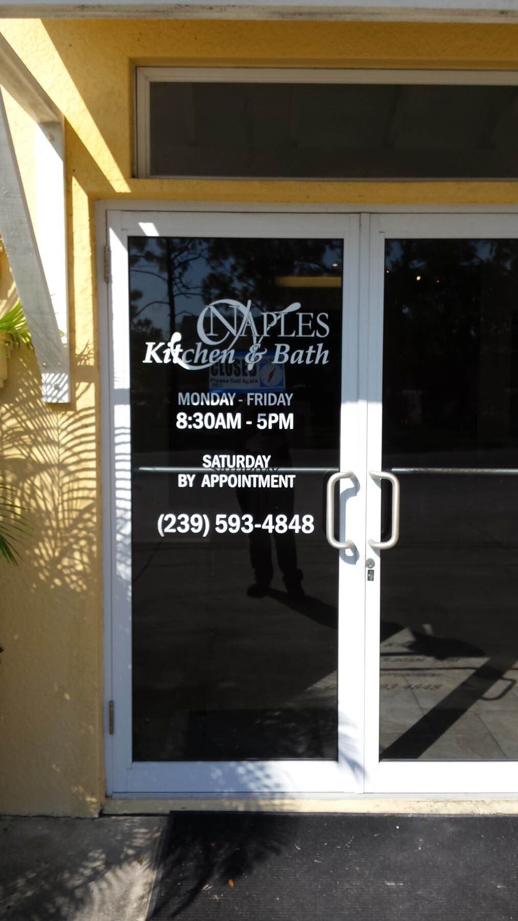 A door with a sign on it that says kitchen & bath