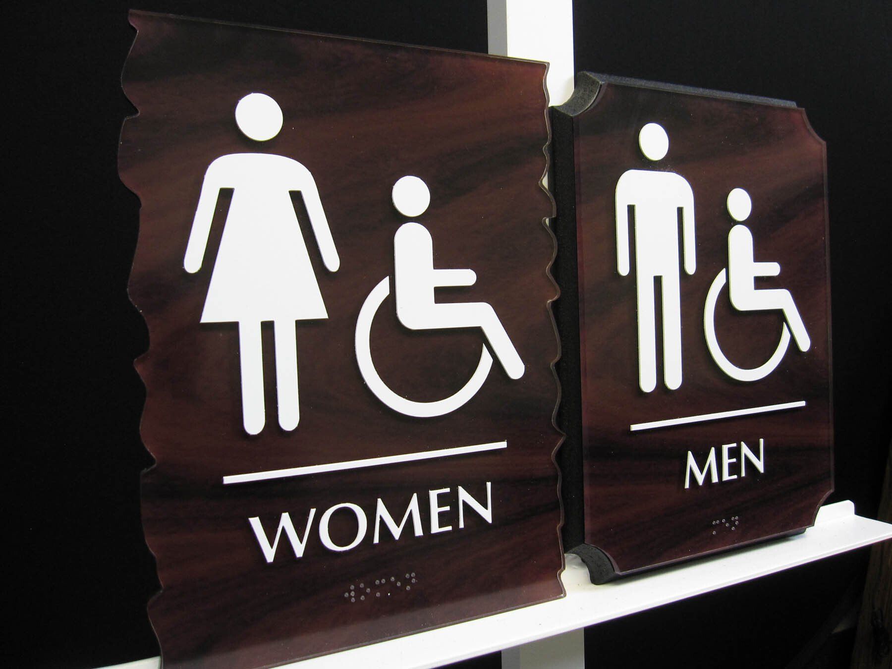 A woman in a wheelchair is next to a man in a wheelchair