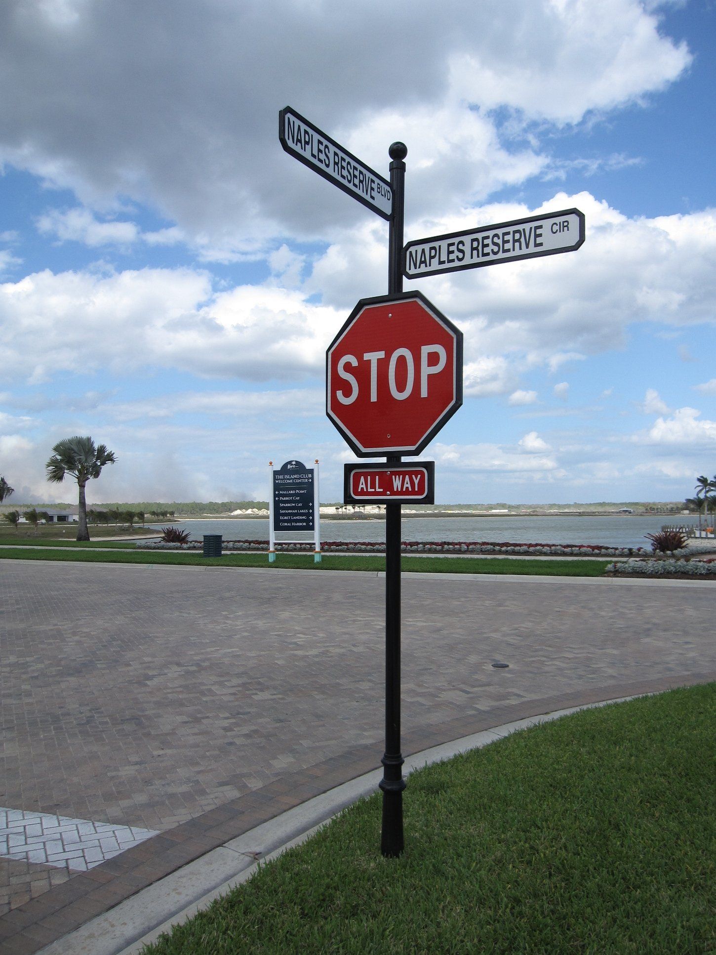 A stop sign is surrounded by other street signs