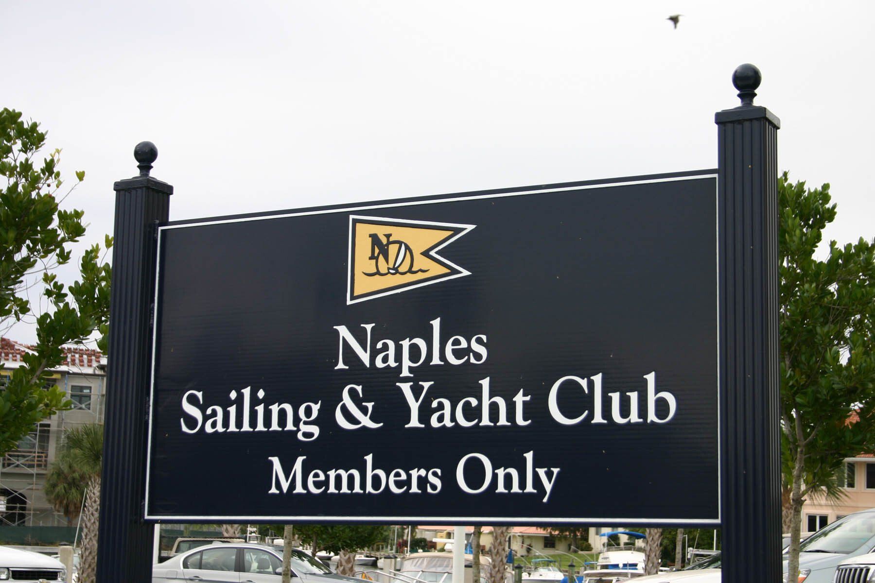 A sign for naples sailing and yacht club members only
