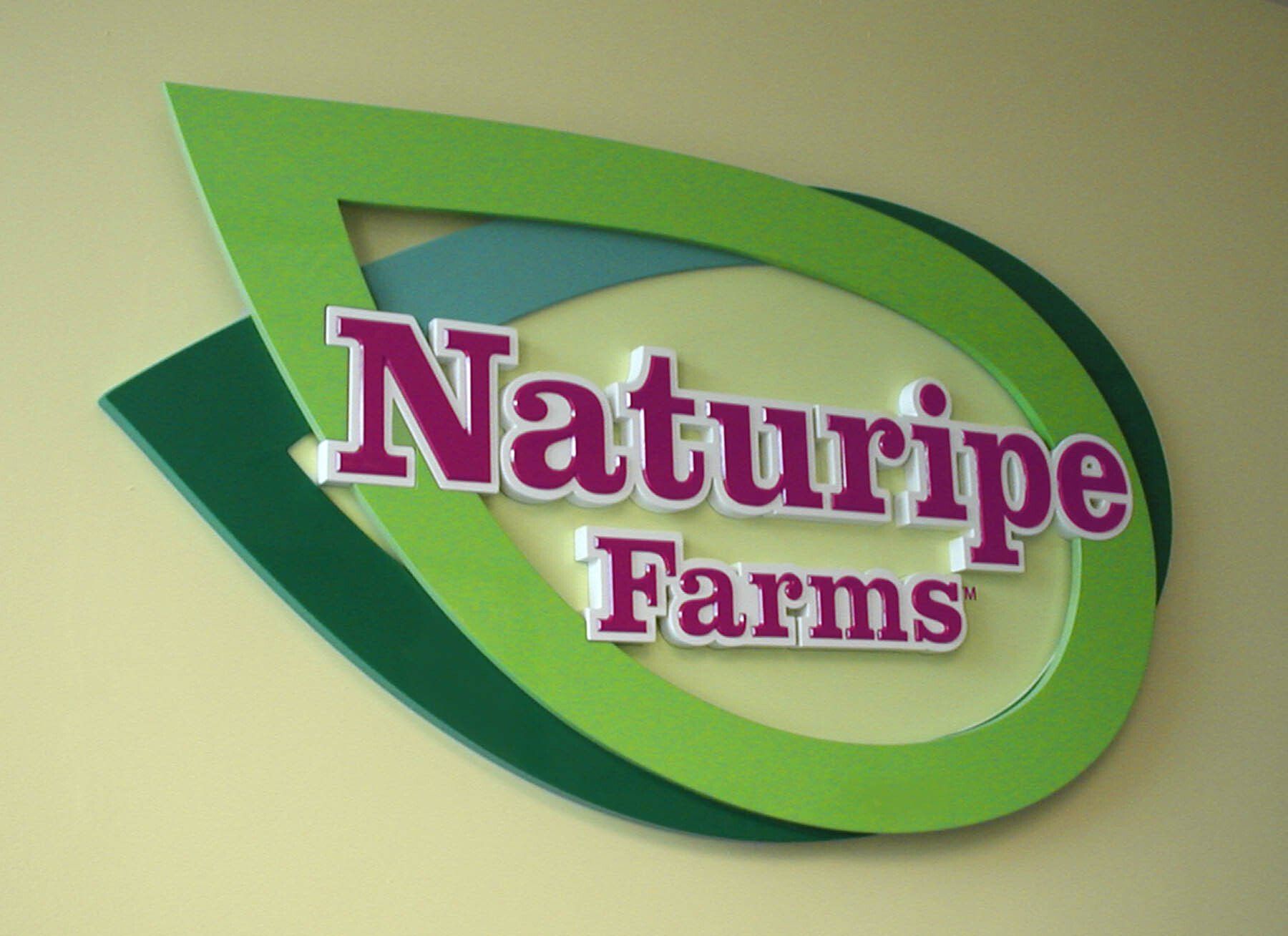 A sign that says naturipe farms on it