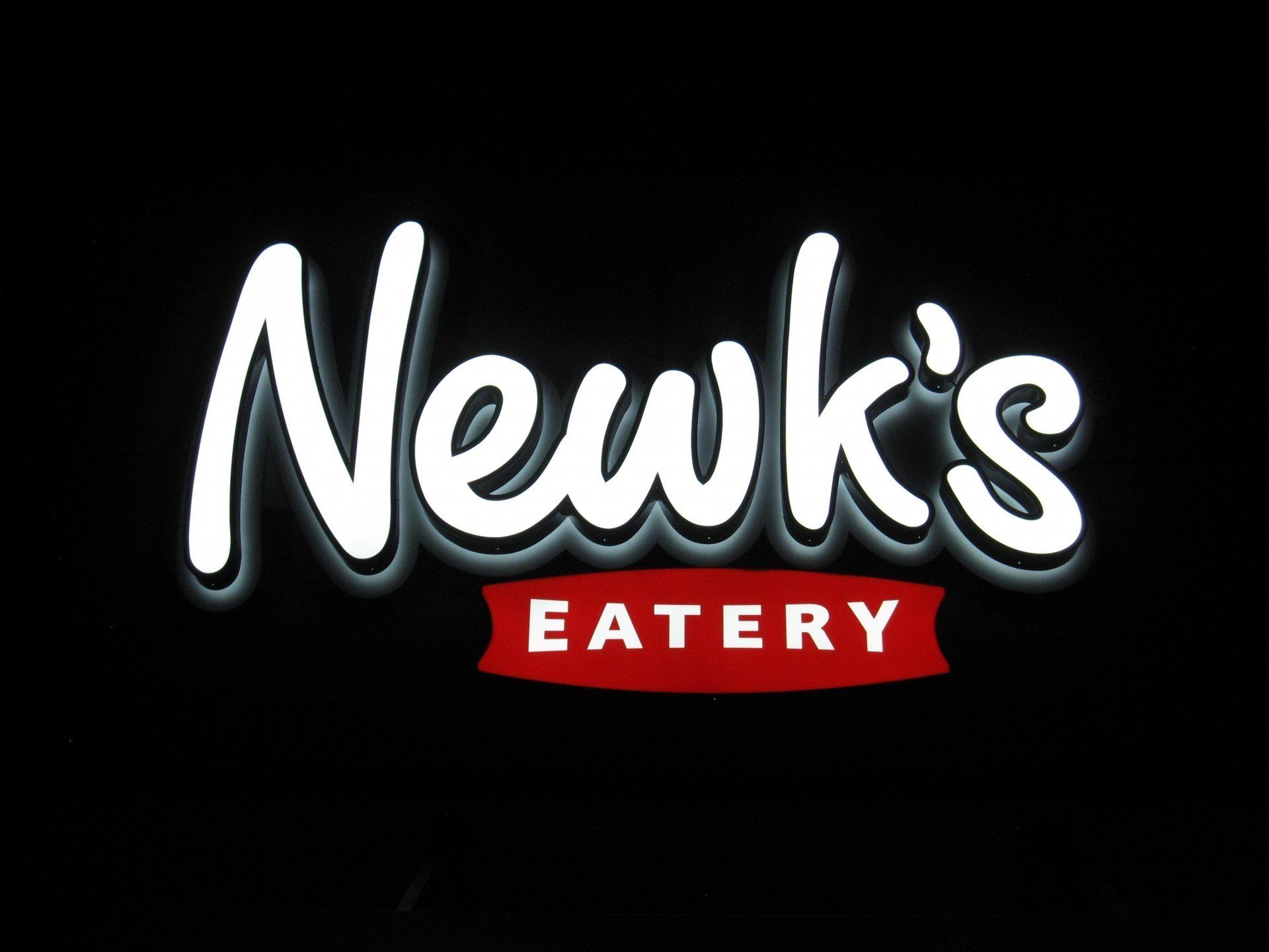 The newk 's eatery logo is on a black background