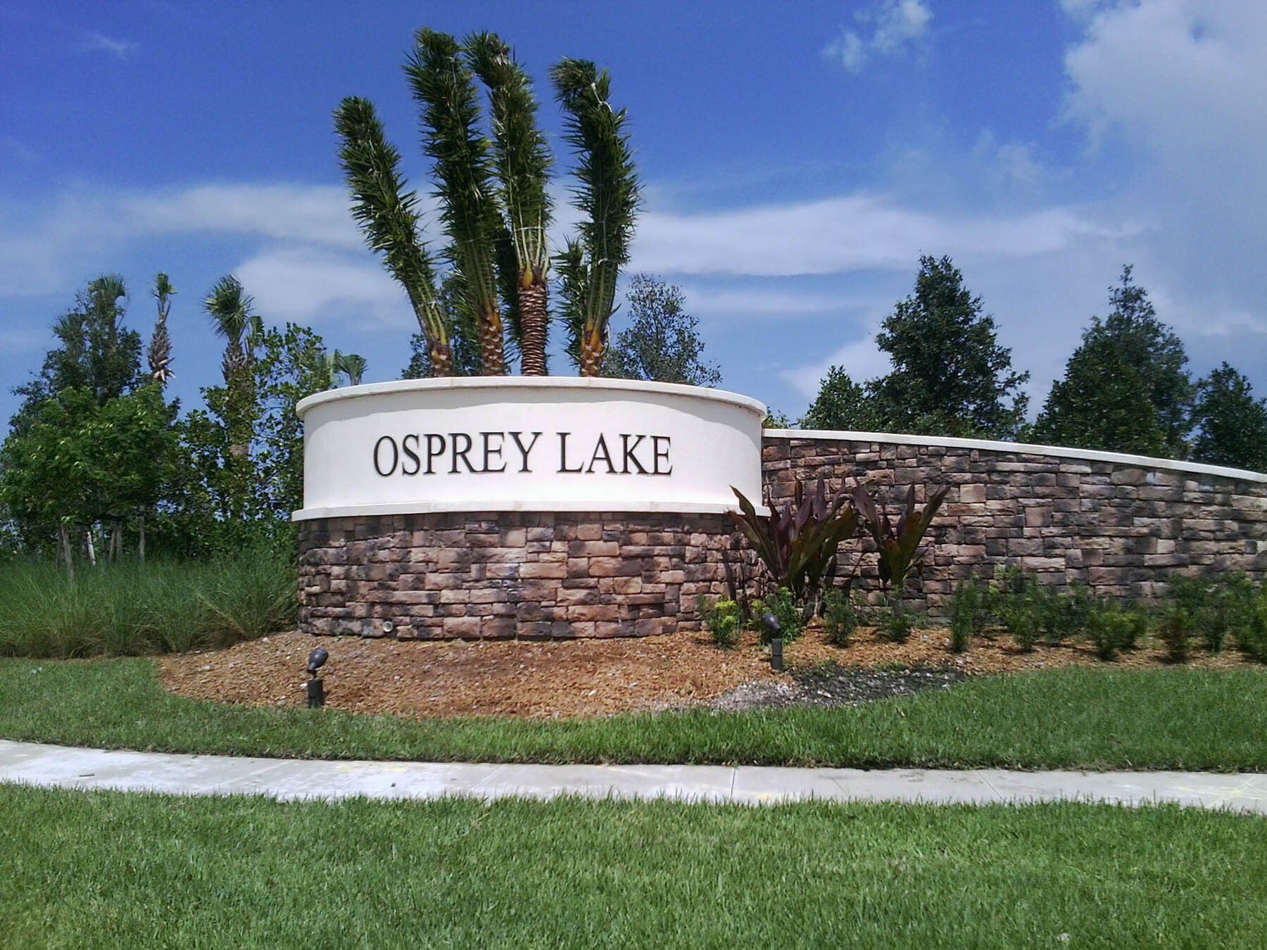 A sign that says osprey lake on it