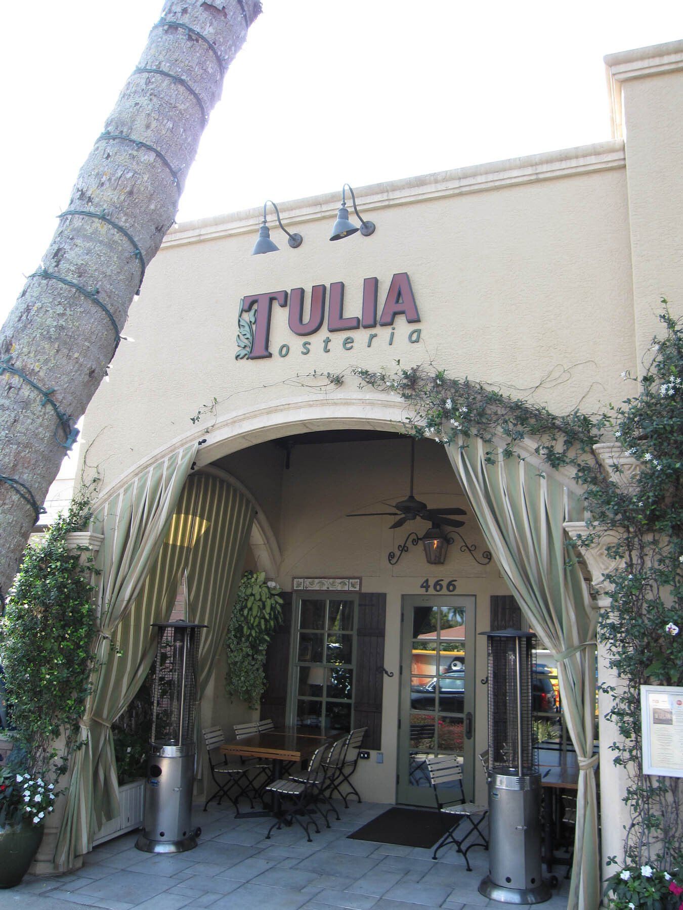 A building with a sign that says ' tulia ' on it