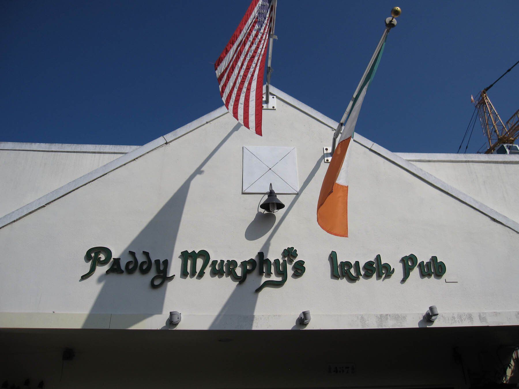 Paddy murphy 's irish pub has an american flag and an irish flag