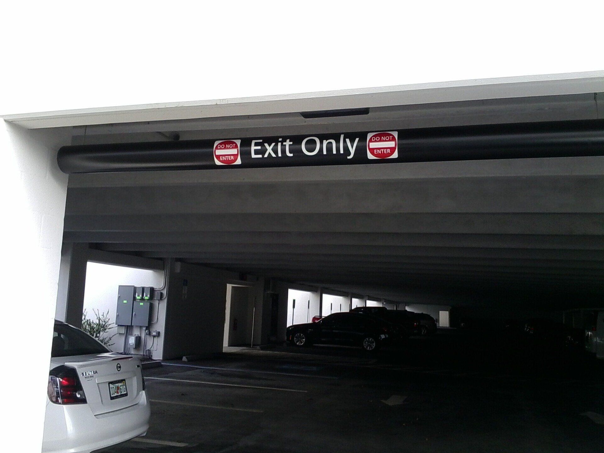 A sign in a parking garage says exit only