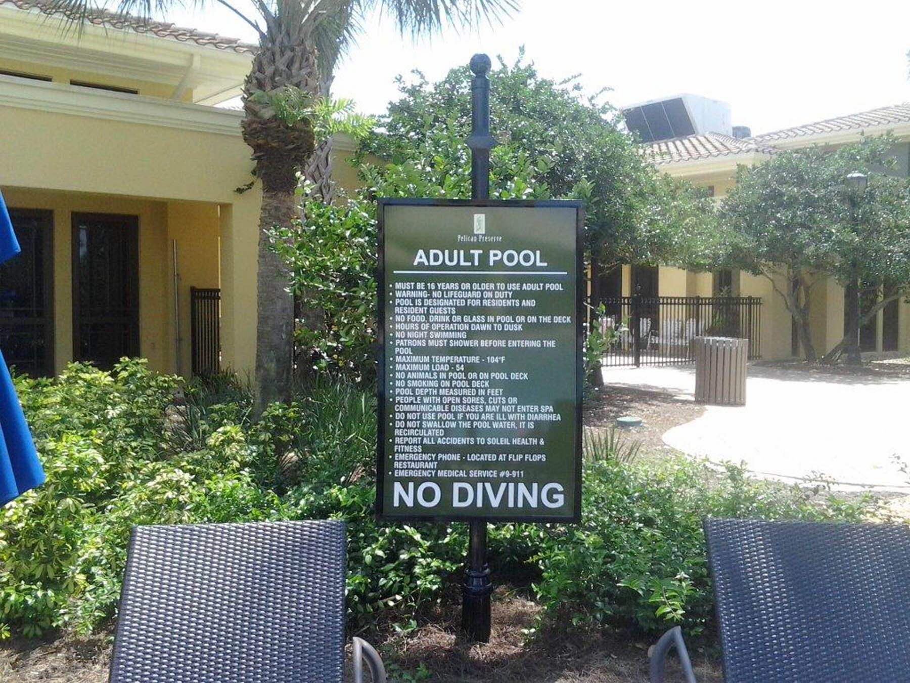 A sign for an adult pool says no diving