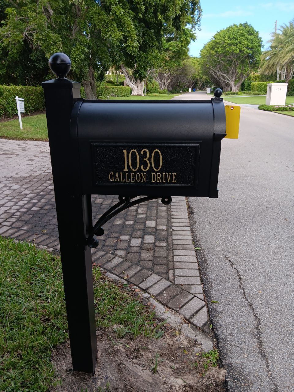 A black mailbox with the address of 1030 gallery drive