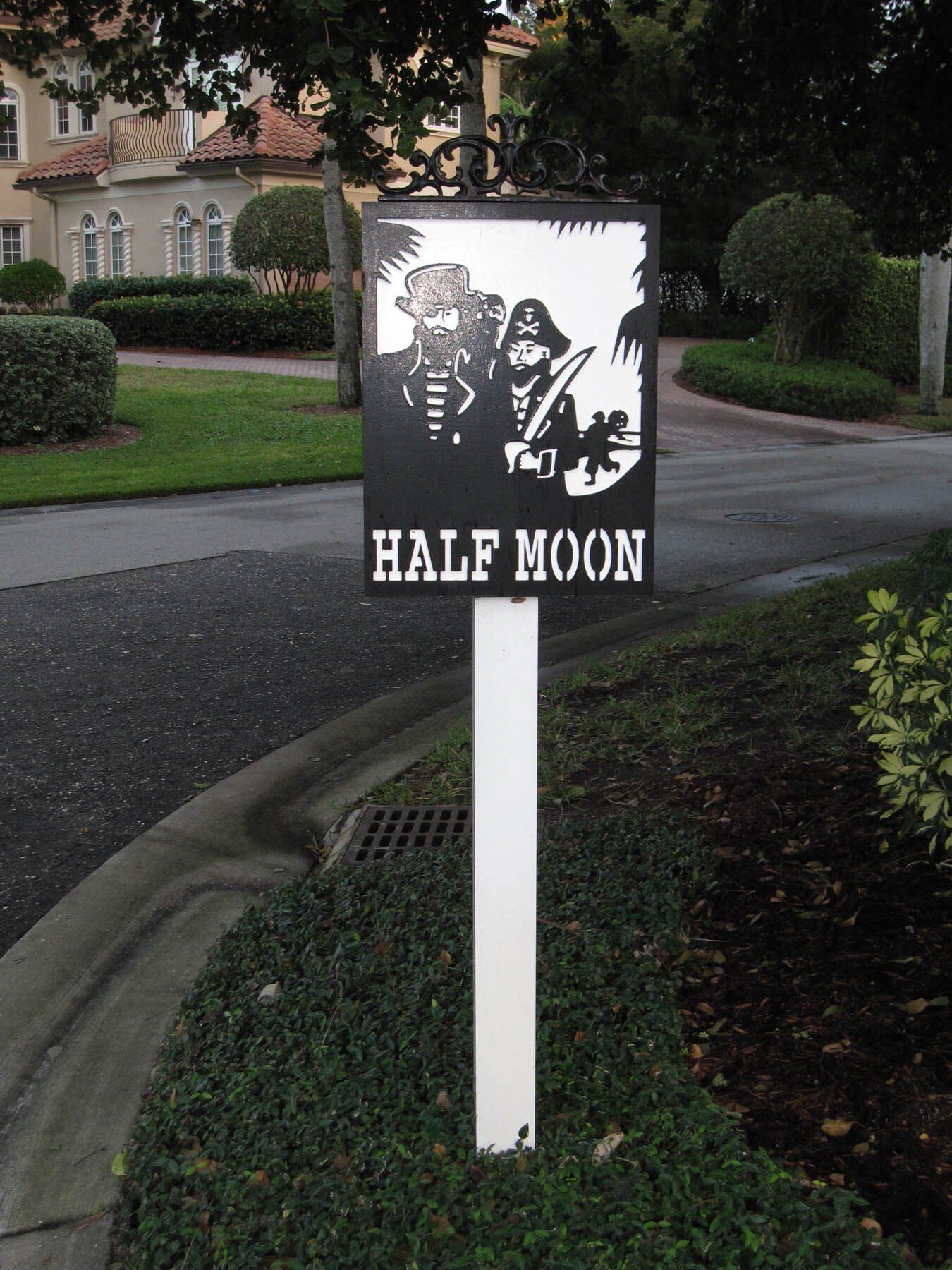 A sign that says half moon on it