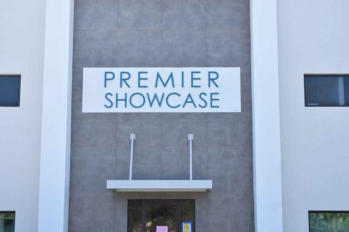 A building with a sign that says premier showcase