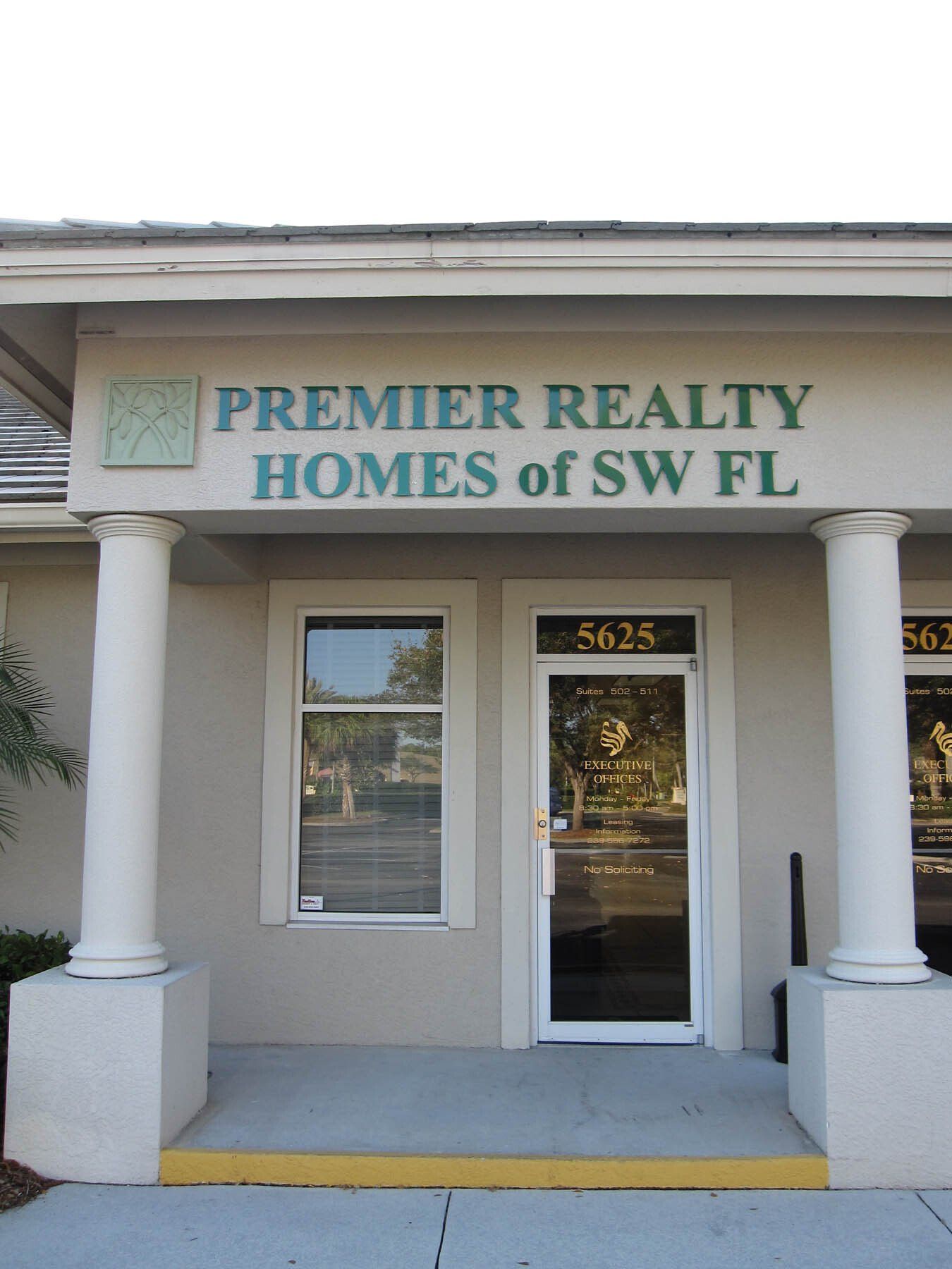 The front of a premier realty homes of sw fl building