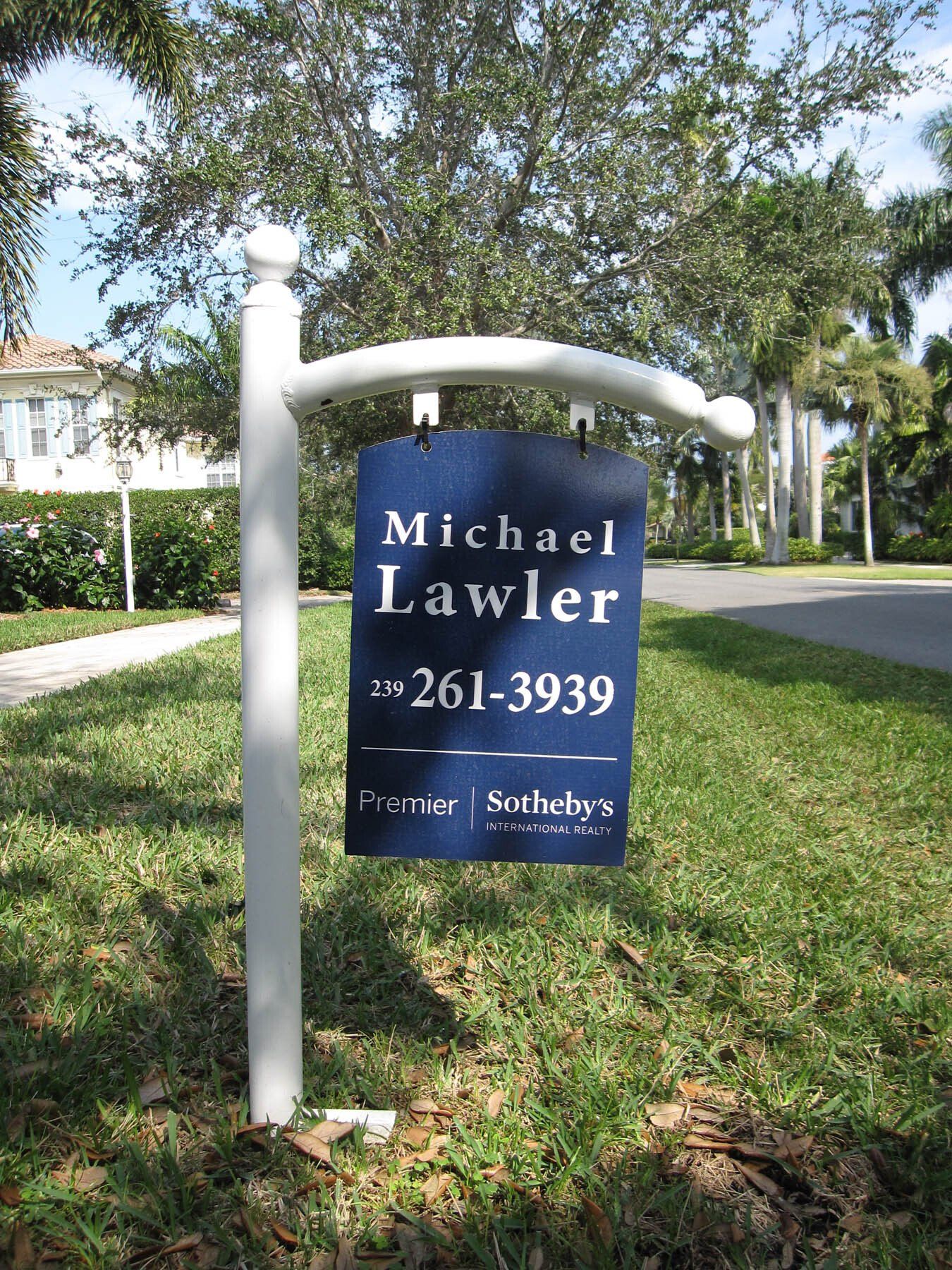 A blue sign that says michael lawler on it