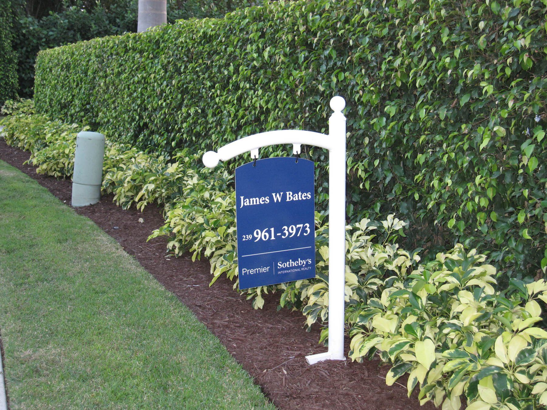 A blue sign that says jason m. bates on it