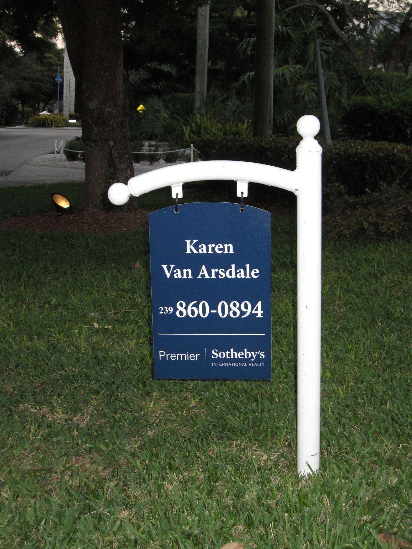 A blue sign that says karen van arsdale on it