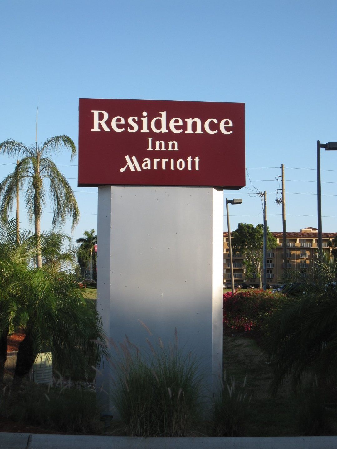 A red and white sign for residence inn marriott