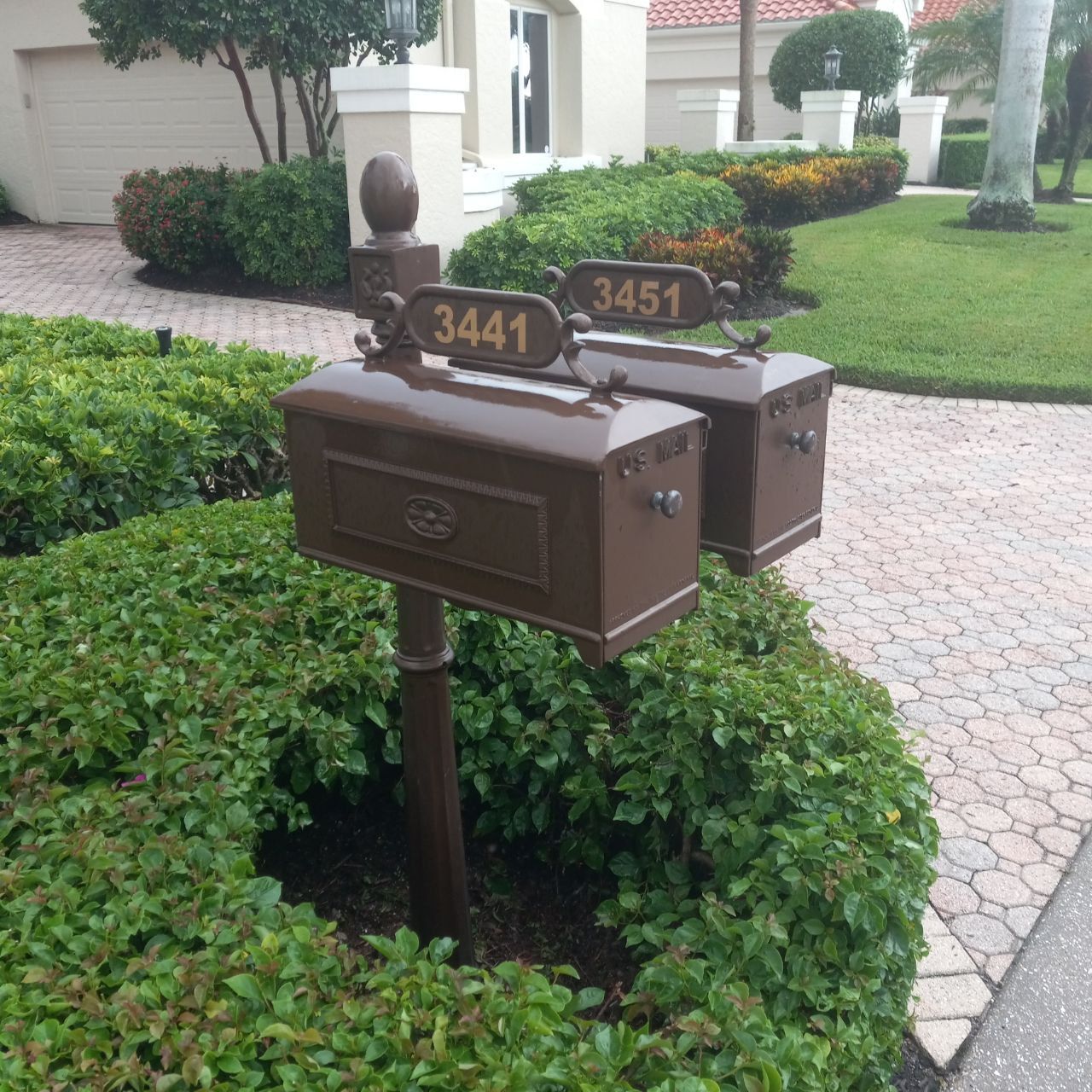 Two mailboxes with the numbers 3441 and 3451 on them