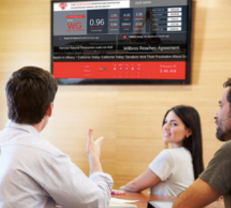 A group of people are sitting at a table looking at a screen that says 0.96