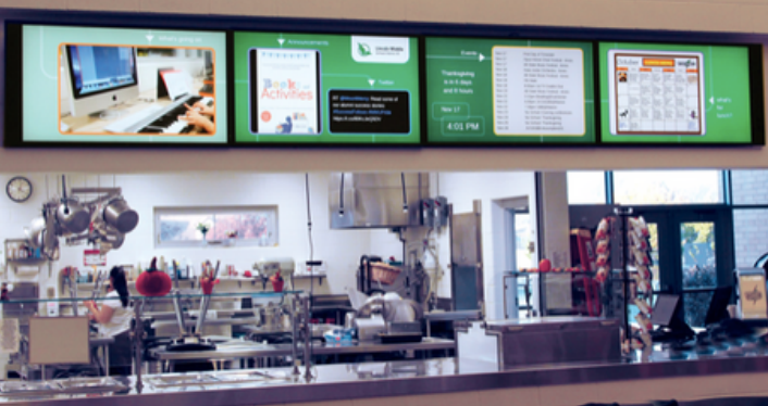 A blurred image of a kitchen with a menu on the wall