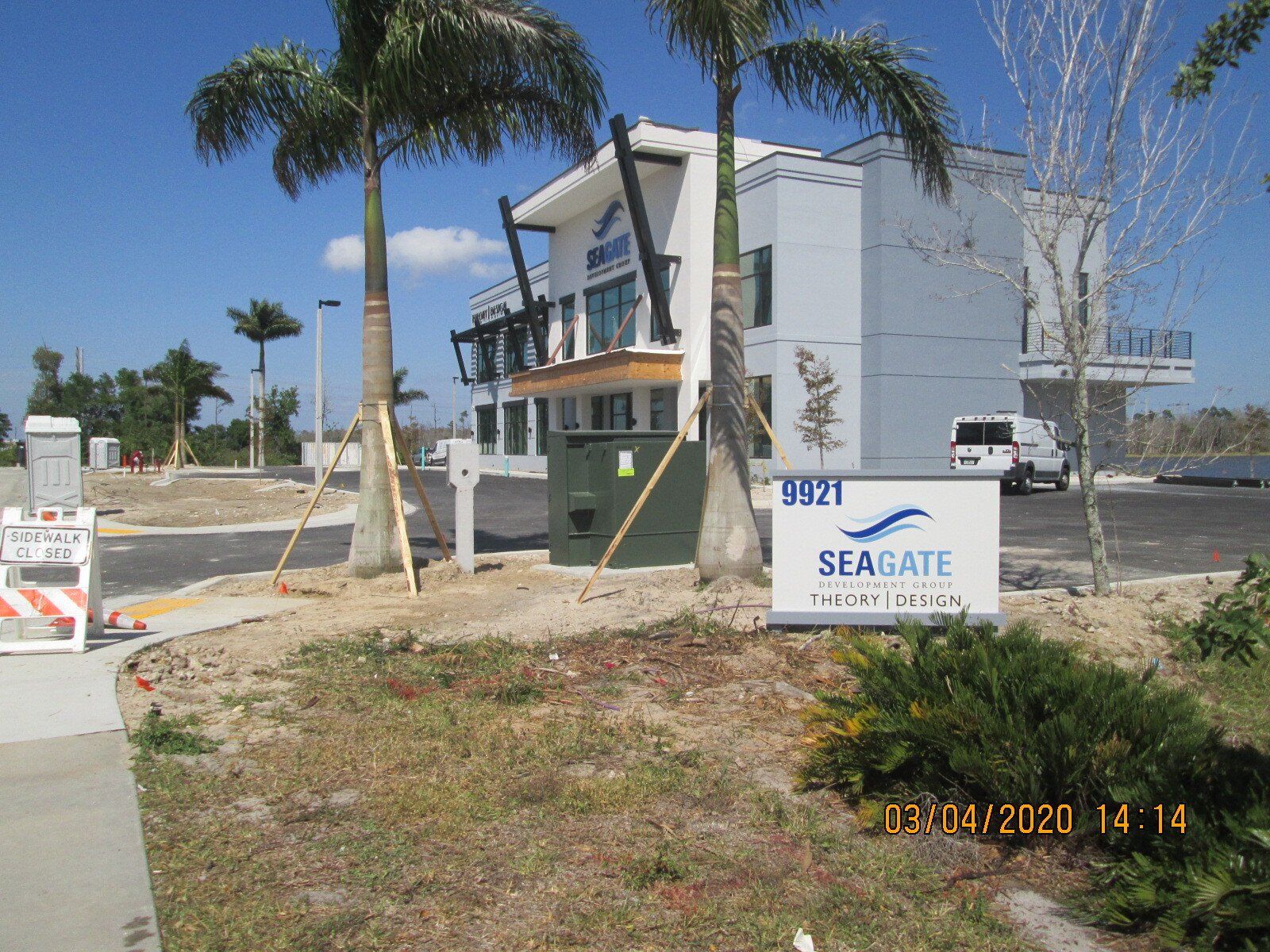 A white building with a seagate sign in front of it
