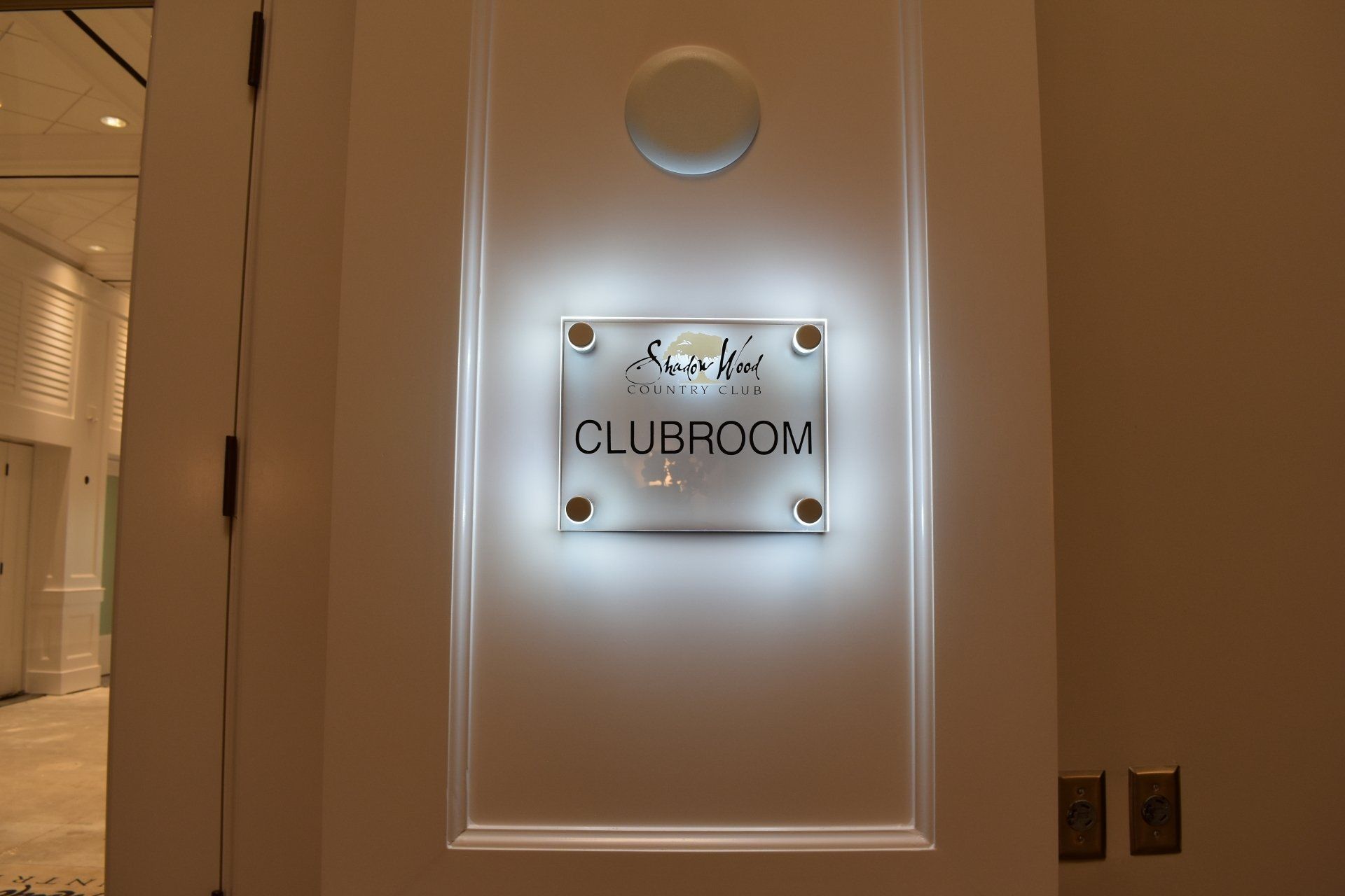 A white door with a sign that says clubroom on it