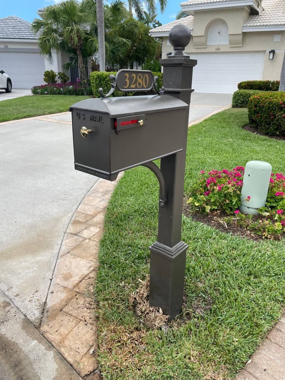 A mailbox with the address 3280 on it