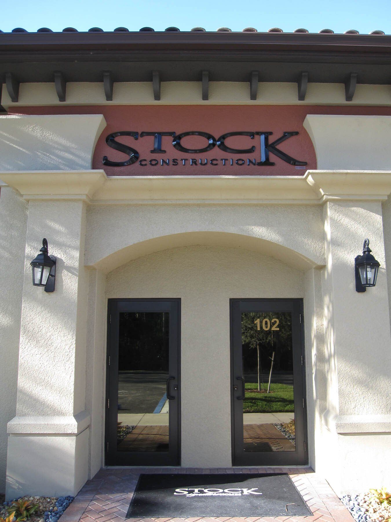 A building with a sign that says stock construction