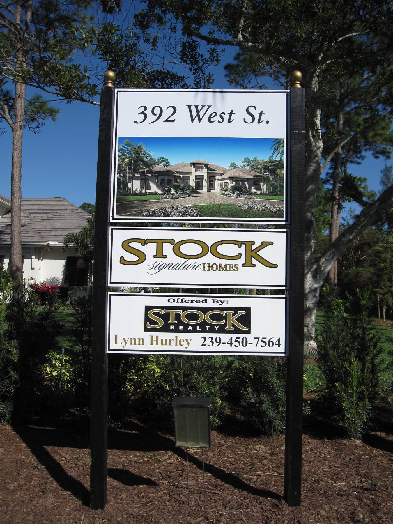 A sign that says 392 west st. on it