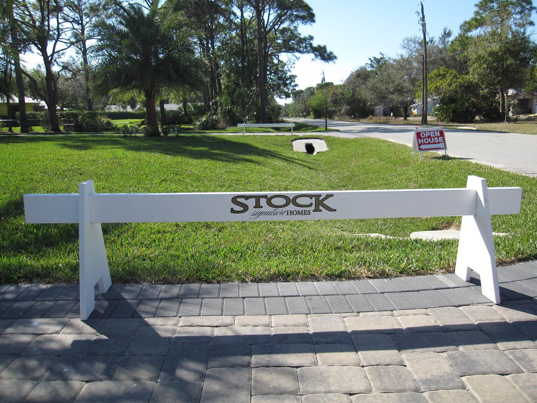 A white fence with the word stock on it