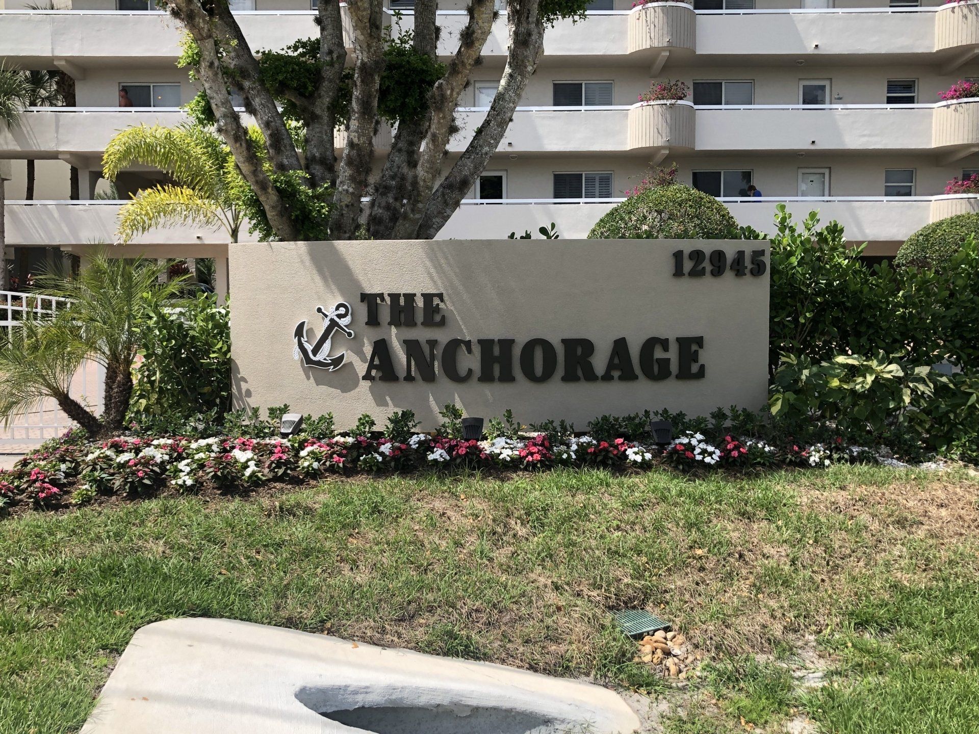 A sign for the anchorage is in front of a building