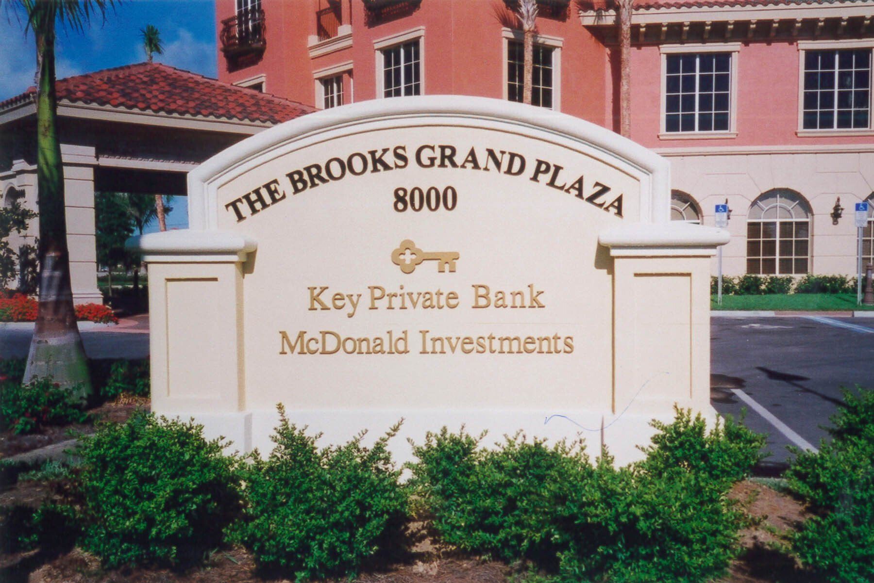 A sign for the brooks grand plaza says key private bank mcdonald investments