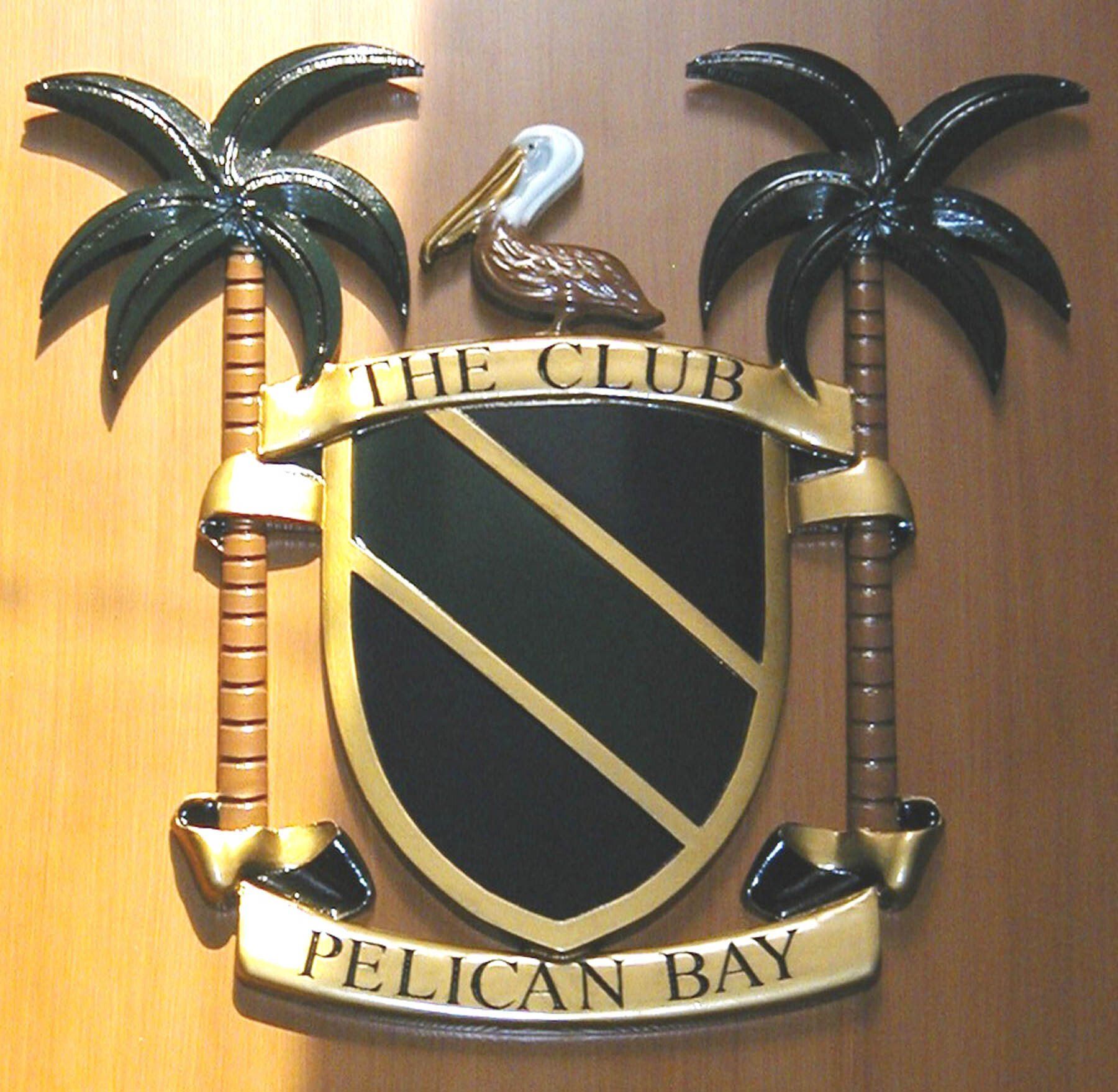 A pelican is on top of a shield that says the club pelican bay