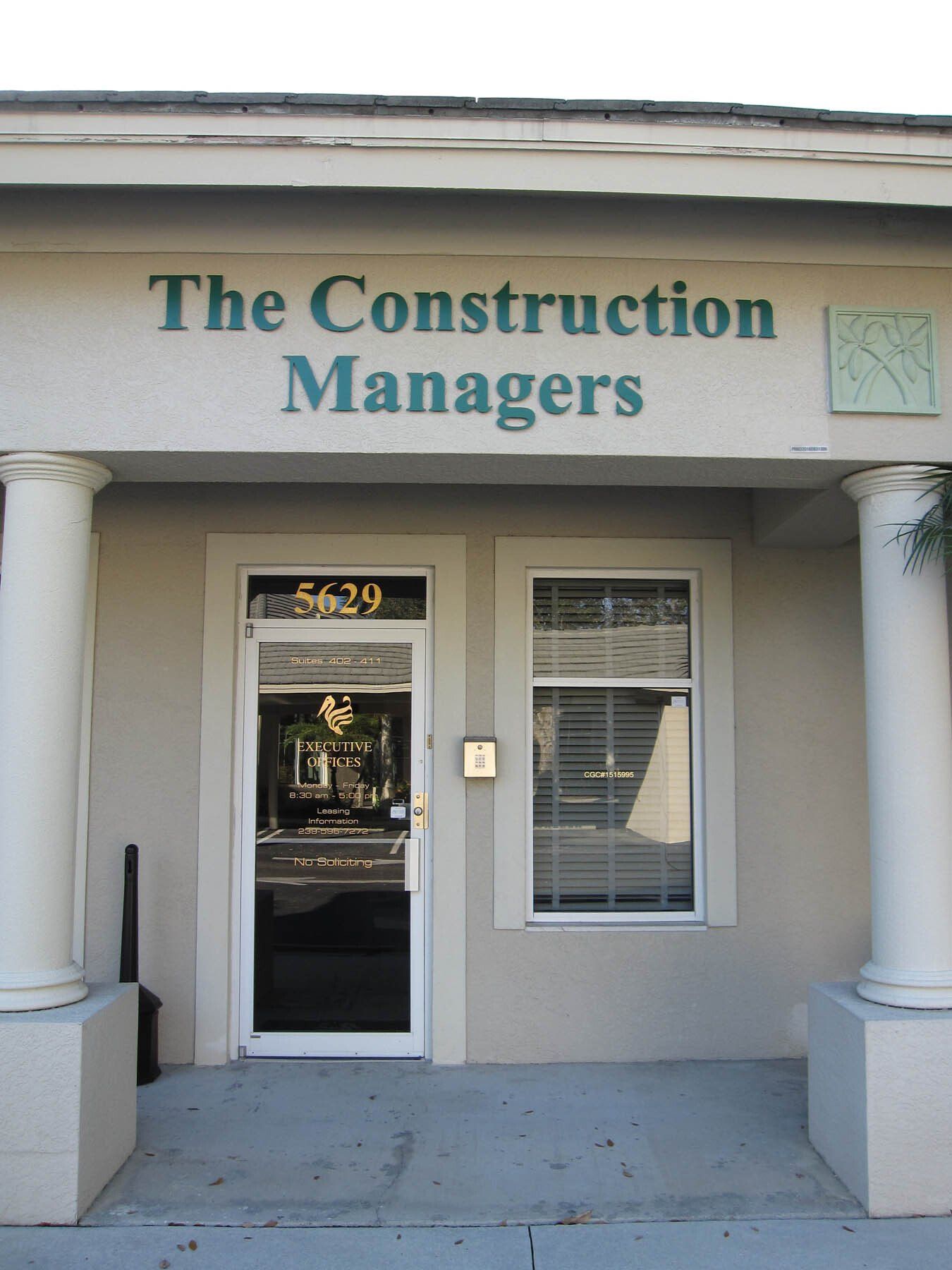 A building with a sign that says the construction managers