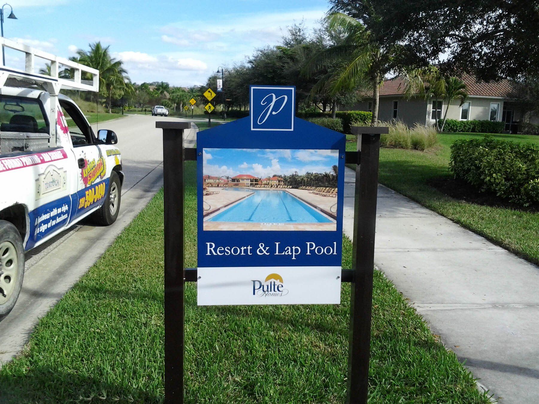 A sign that says resort and lap pool on it