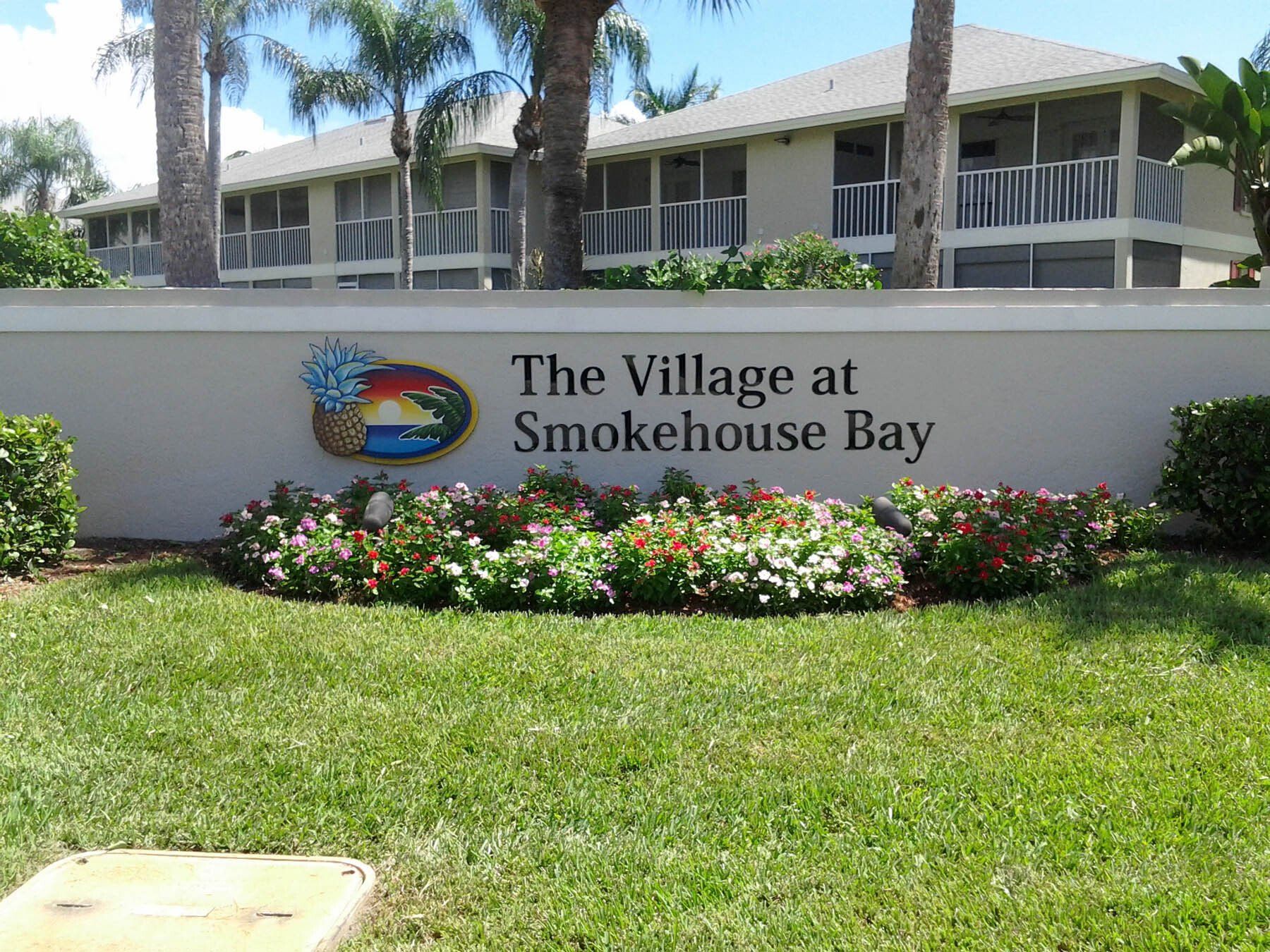 A sign that says the village at smokehouse bay