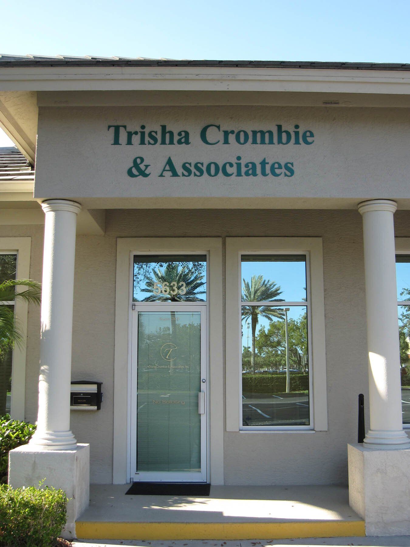 A building with a sign that says trisha crombie & associates