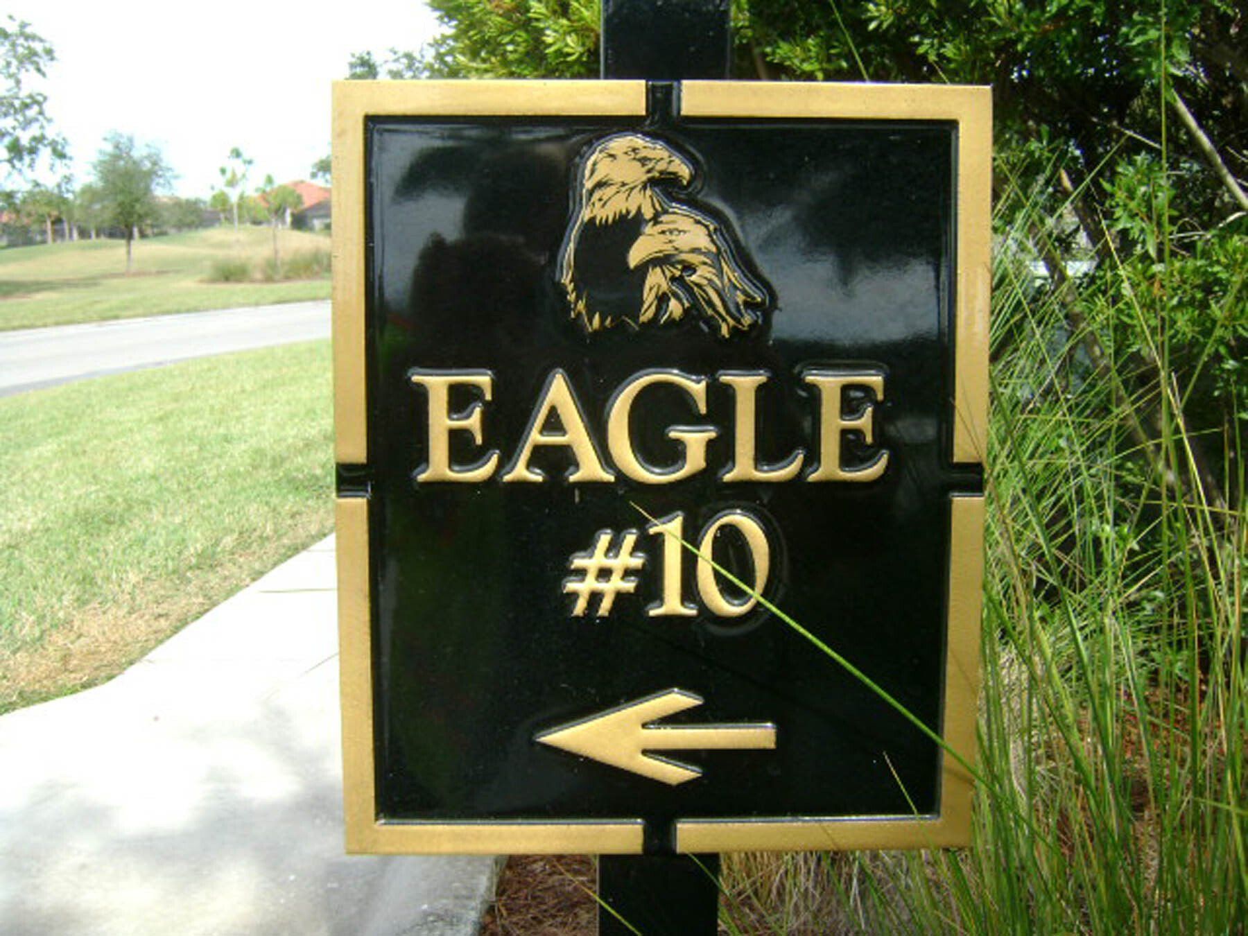 A black and gold sign that says eagle # 10