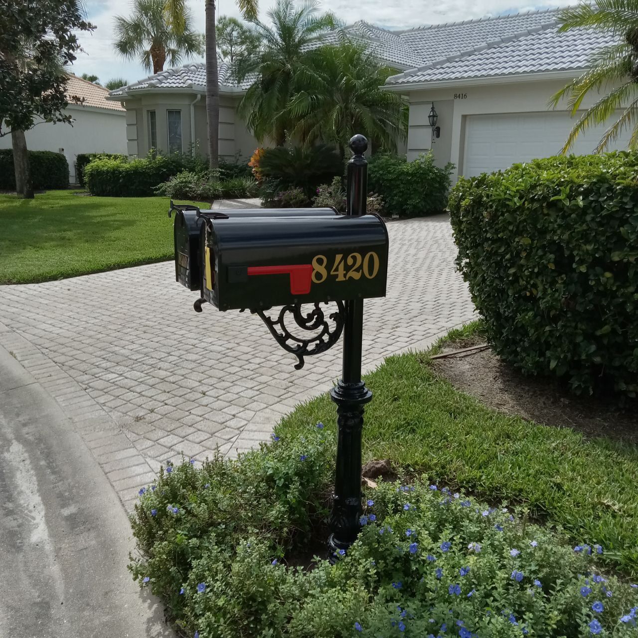 A black mailbox with the address 8420 on it