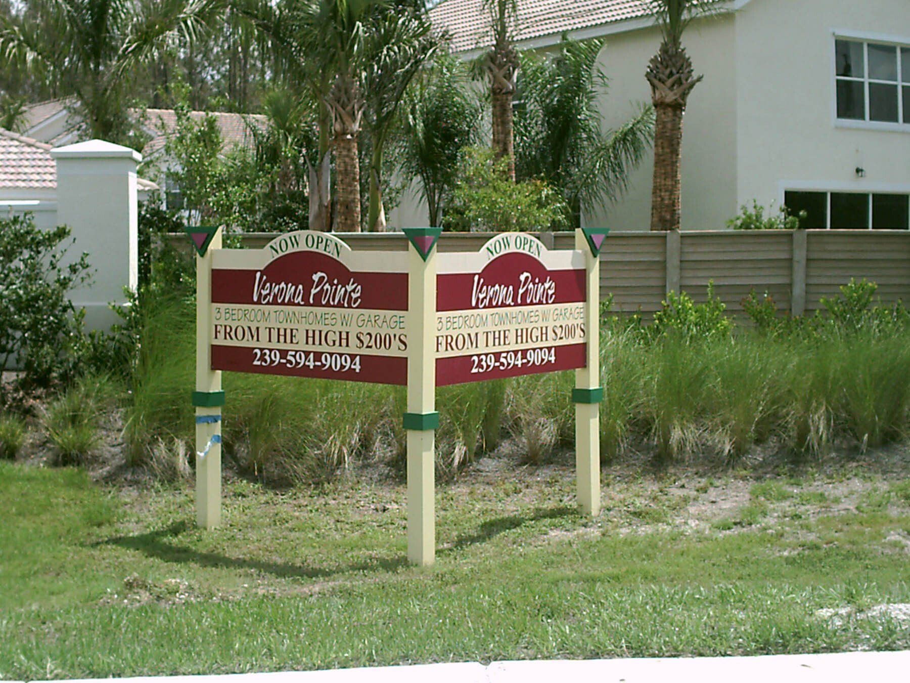 A couple of signs that say homes for sale