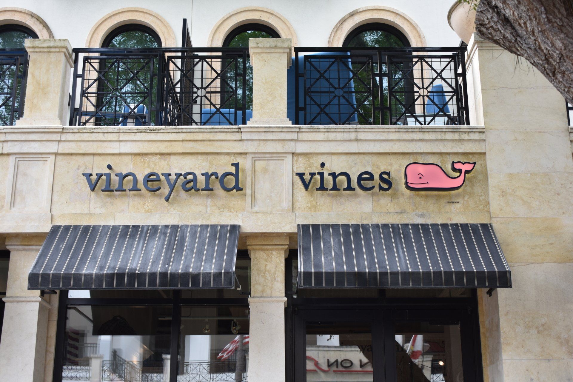The front of a vineyard vines store with awnings