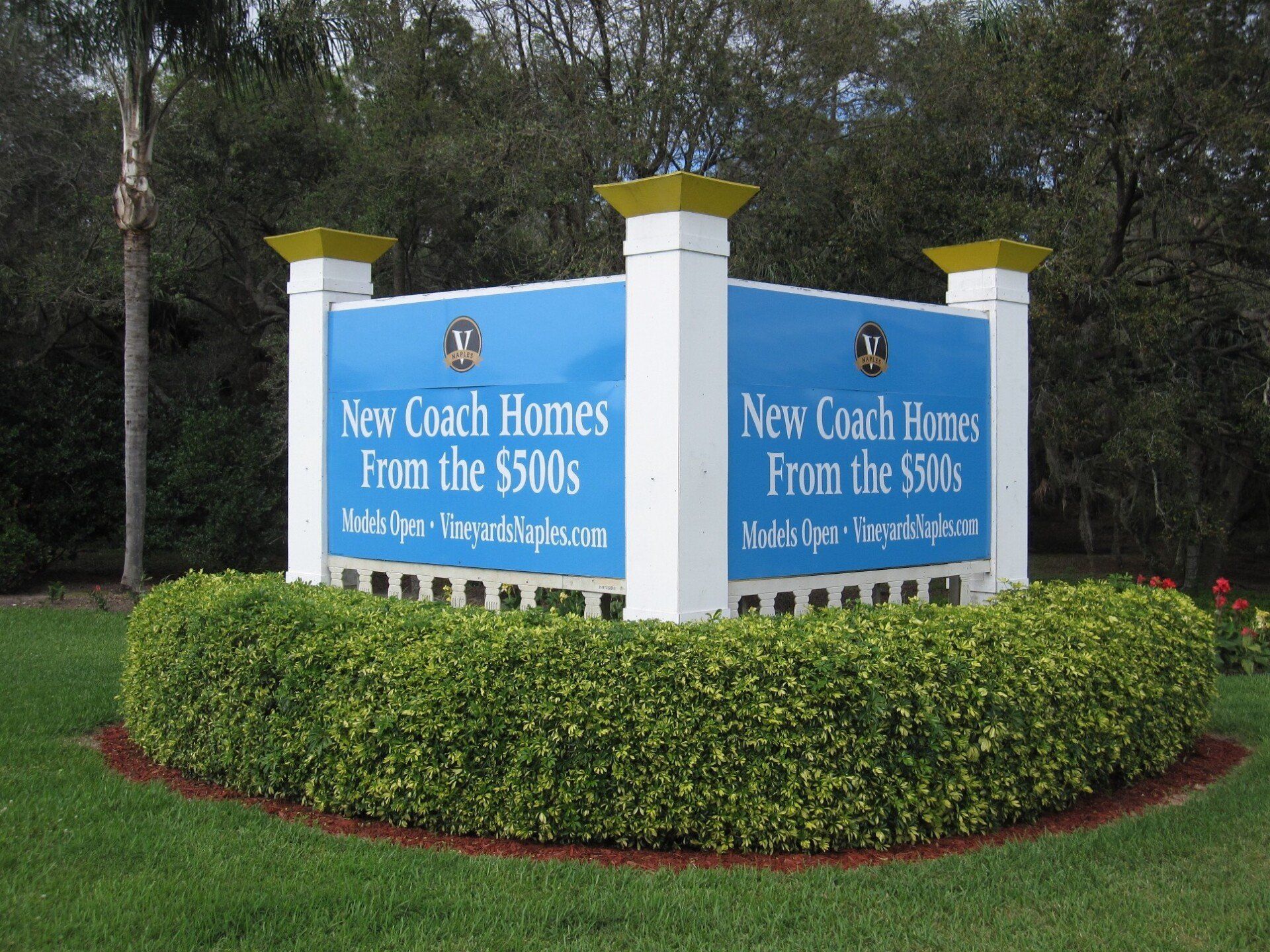 A sign that says new coach homes from the $ 500 's