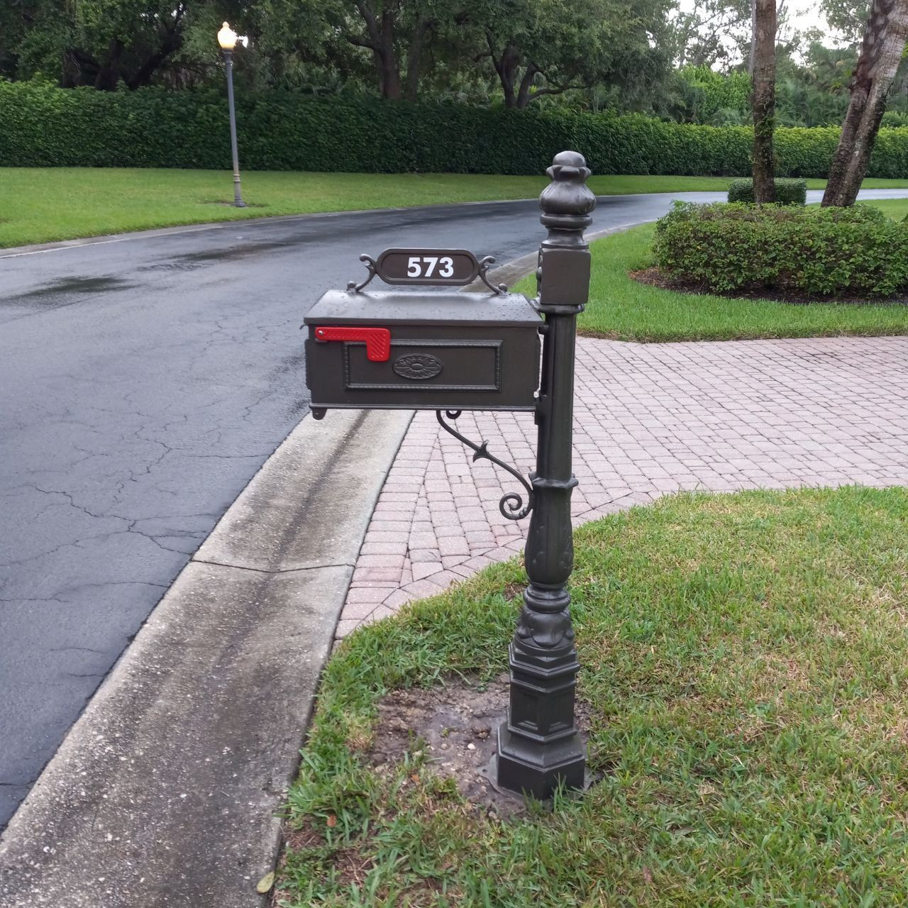 A mailbox with the number 573 on it